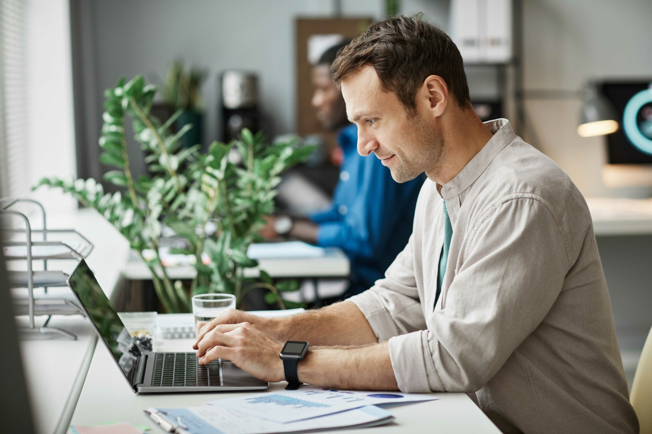 man working on chromebook